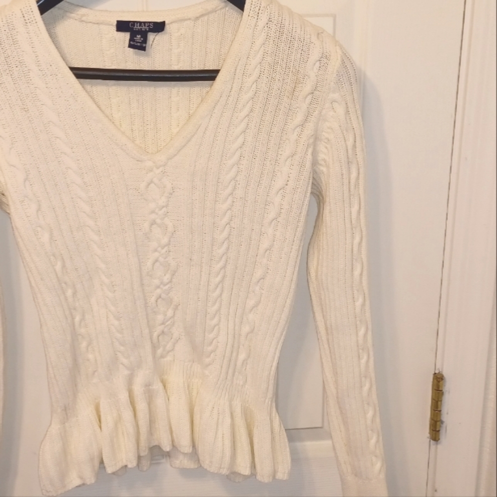 Puplum Style Sweater and leather like straight leg jeans.